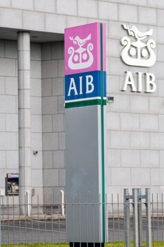 Exterior street view of an Allied Irish Bank branch in Dublin, Ireland, showing the iconic corporate signage and architectural facade of a major commercial financial services institution.