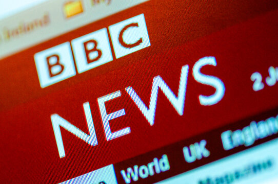 Close up view of the BBC News website header displayed on a digital screen, showing the iconic red logo and navigation menu.
