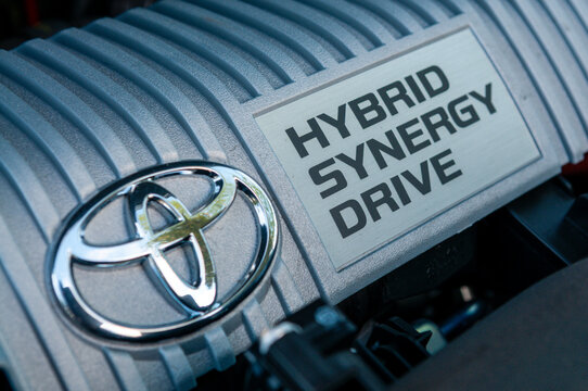A Toyota Prius hybrid petrol engine with an electric motor, internal combustion engine, and transmission system used in fuel efficient vehicle technology,