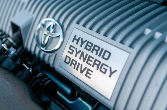 A Toyota Prius hybrid petrol engine with an electric motor, internal combustion engine, and transmission system used in fuel efficient vehicle technology,