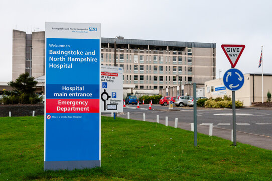 Exterior shot of the main sign at the entrance to Basingstoke and North Hampshire Hospital, highlighting the blue and white NHS branding