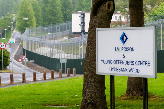 A white sign at the high-security entrance to Hydebank Wood Young Offenders Centre and female prison in Belfast, Northern Ireland.