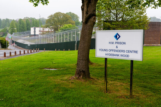 A white sign at the high-security entrance to Hydebank Wood Young Offenders Centre and female prison in Belfast, Northern Ireland.