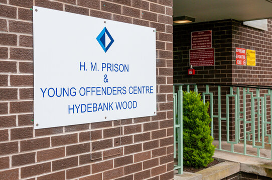 A white sign at the high-security entrance to Hydebank Wood Young Offenders Centre and female prison in Belfast, Northern Ireland.