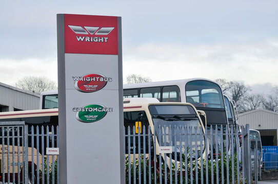 Signage and corporate branding outside the Wrightbus manufacturing headquarters in Ballymena, Northern Ireland, a global leader in zero-emission bus technology