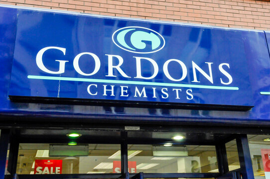 Sign outside a Gordons Chemists branch on a Northern Ireland high street.