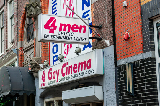 The exterior of 4 Men Erotic Entertainment Centre on Spuistraat, Amsterdam, a notable gay cinema and adult shop featuring a bold storefront, private video cabins, and a specialized retail space.