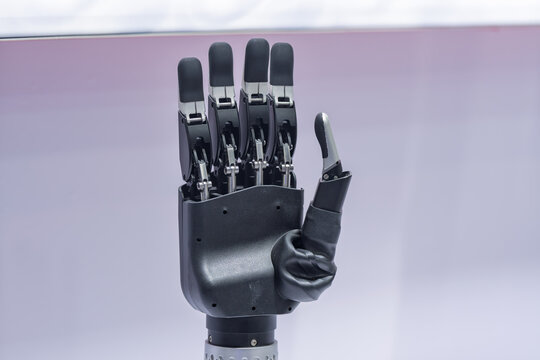 High tech bionic robotic hand making pinky lift gesture