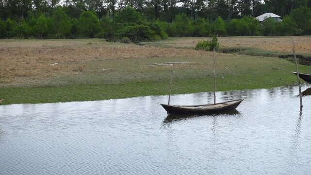 Some small wooden fishing boats seen on the way to Char Kukri Mukri union, Bhola District