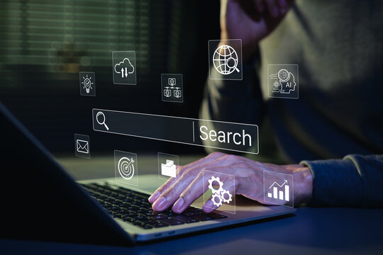 SEO search engine optimization concept. Person typing on laptop with digital search bar and marketing icons to represent web browsing data analysis, professional online discovery, AI search, SEM, GEO