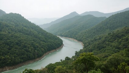 Fototapeta premium A serene river flowing through a lush mountain landscape, showcasing nature's beauty