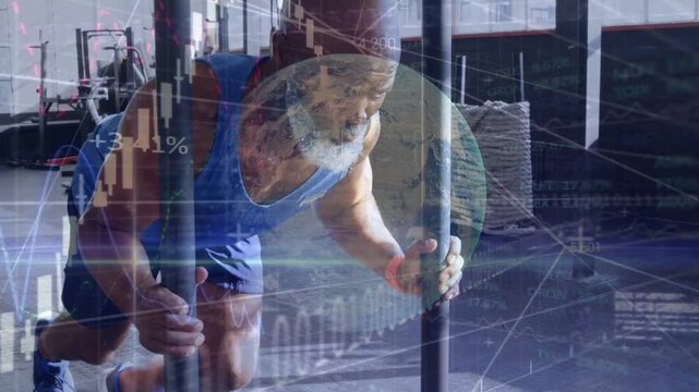 Athlete planting foot and pushing sled in gym, animated candlesticks over torso tracking fitness
