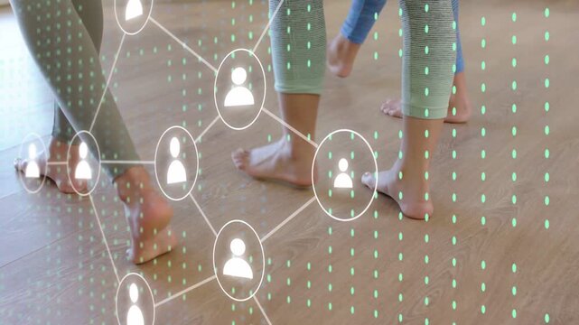 Three women walking wood floor, stepping activating icons forming fitness network overlaying legs