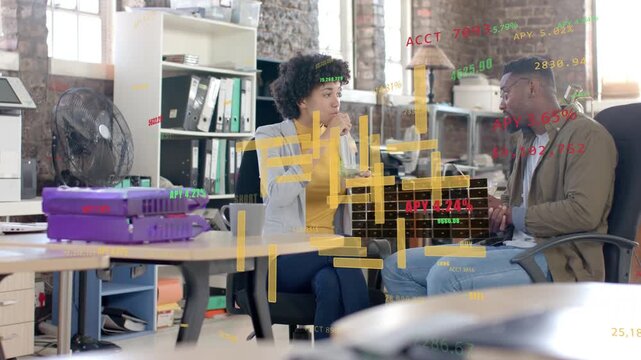 Woman holding mug pointing at floating finance charts, causing man tapping phone and analyzing data