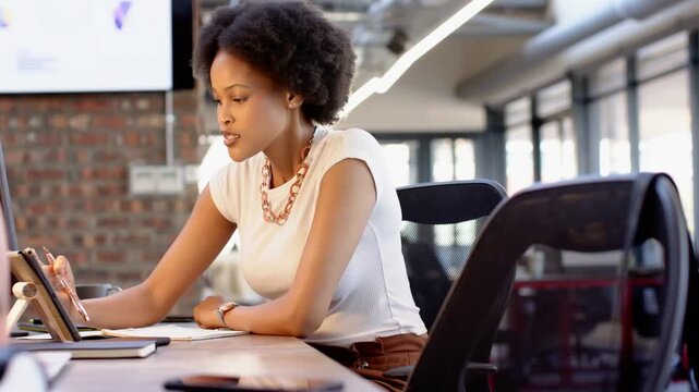 Yellow purple lightning sliding in, causing woman using stylus on tablet for business, smiling