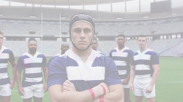 Team captain standing as camera pulling back showing scrum cap goalposts for rugby portrait