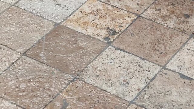 Heavy Raindrops Falling on Natural Slate Stone Surface