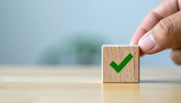 Hand Placing Wooden Block with Green Check Mark Icon for Success and Approval