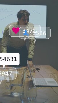 Vertical video: Business lead pointing to chart showing social counts for metrics, stepping aside
