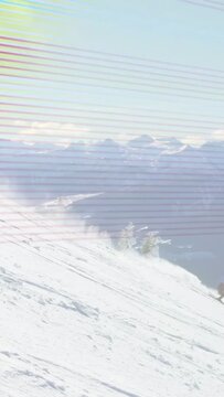 Vertical video: Crouch launch sending rider carving to descend, spraying powder; scanlines moving