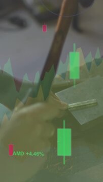 Vertical video: Woman tapping rod with mallet, forming metal while stock charts float over hands