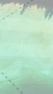 Vertical video: Teal paper revealing dashed trail bending as trees rising, showing route to forest