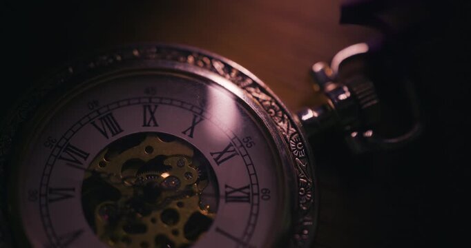 Close up of ticking pocket watch