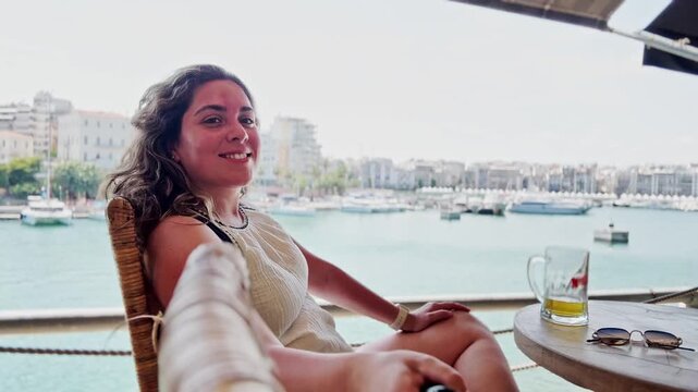 Cold Beer in Greece: Woman Enjoys a Drink