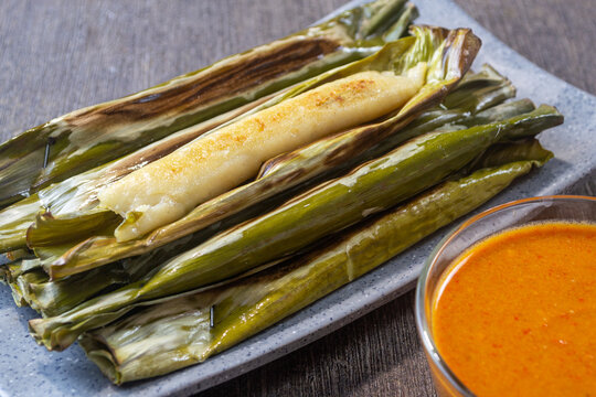 Otak-otak indonesian snack, made from minced fish meat mixed with tapioca or sago flour, coconut milk and spices, then wrapped in banana leaves and grilled