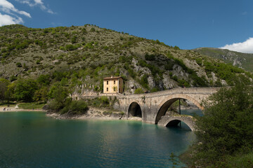 Naklejka premium South of Italy old bridge on a lake