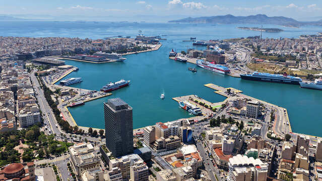 Aerial drone photo of famous busy port of Piraeus with recently renovated tower, Attica, Greece