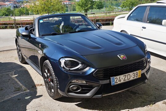 Abarth 124 Spider parked on sunny day