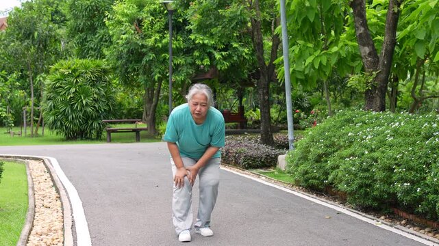 Walking challenge: A senior individual endures physical difficulties during a brisk walk, showcasing the determination to persist despite physical discomfort in the path of the park.