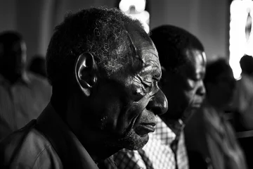 Generative AI image of christians gathered in a church praying © Tetiana