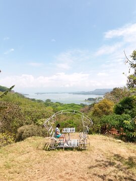 Tourist looks at tropical lake.
Aerial drone view of the islands on Lago Suchitlan in El Salvador. The Cerr&oacute;n Grande Reservoir, also known locally as Lake Suchitl&aacute;n