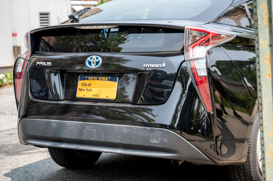 New york, usa august 16,2024. Toyota prius hybrid with new york city government license plate parked on a nyc street, rear view emphasizing eco friendly urban transport