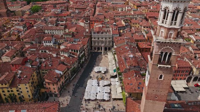 Aerial Drone View of Piazza delle Erbe in Verona, Italy . Historic Market Square, Medieval Architecture and Panoramic Old Town Cityscape