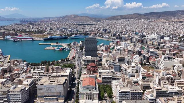 Pi Aerial drone cinematic video from famous busy port of Piraeus and new renovated landmark skyscraper Tower of Piraeus, Attica, Greece