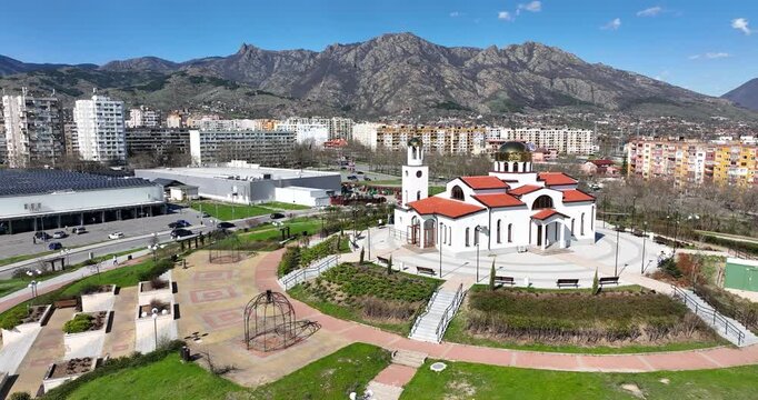 Aerial view over Modern Orthodox Church St. Petka in Sliven city Bulgaria with Balkan Mountains landscape on Background