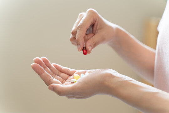 Healthcare Harmony: Close-Up Hands Holding Medication and Water Glass for Optimal Wellness, Pharmaceutical Treatment and mental health treatment