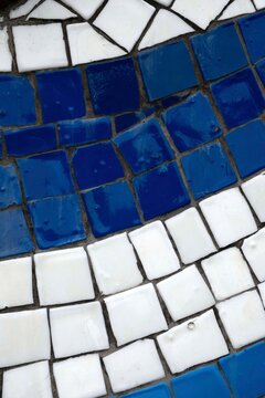 Blue and white ceramic mosaic tiles in a curved pattern