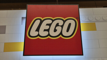 Naklejka premium A close-up of the iconic square red LEGO logo with white and black outlined bubble lettering. Picture taken on April 27, 2026 in Bucharest, Romania.