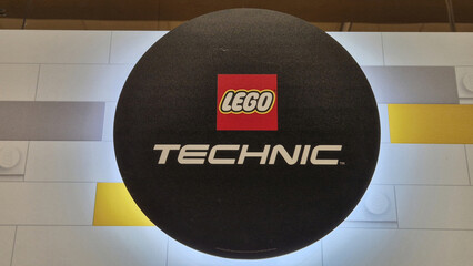 Naklejka premium A circular black LEGO Technic sign featuring the classic red logo and white futuristic typography. Picture taken on April 27, 2026 in Bucharest, Romania.