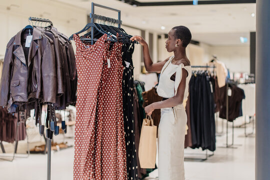 Joyful African American Woman Enjoying Shopping Experience in Boutique