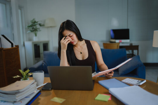 Young woman experiencing stress working home office
