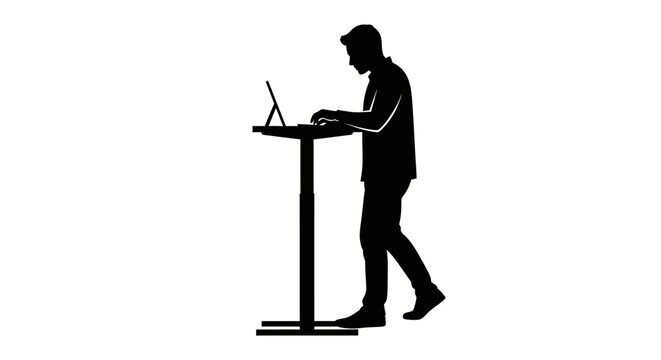 Man working on laptop at standing desk