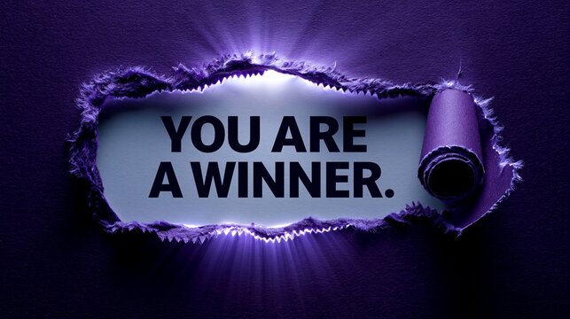 Lila zerrissenes Papier mit dem englischen Satz &bdquo;YOU ARE A WINNER" auf wei&szlig;em Untergrund.