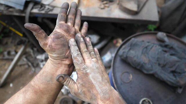 Skilled technician demonstrates precise hand movements while preparing tools for car repair in a garage, showcasing the intricate details of the repair process and the environment