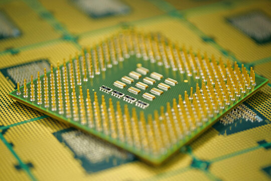 Close up of CPU showing tiny metal pins and their precise alignment
