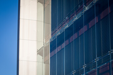 Obraz premium Modern Glass Facade With External Blinds on Contemporary Building Exterior